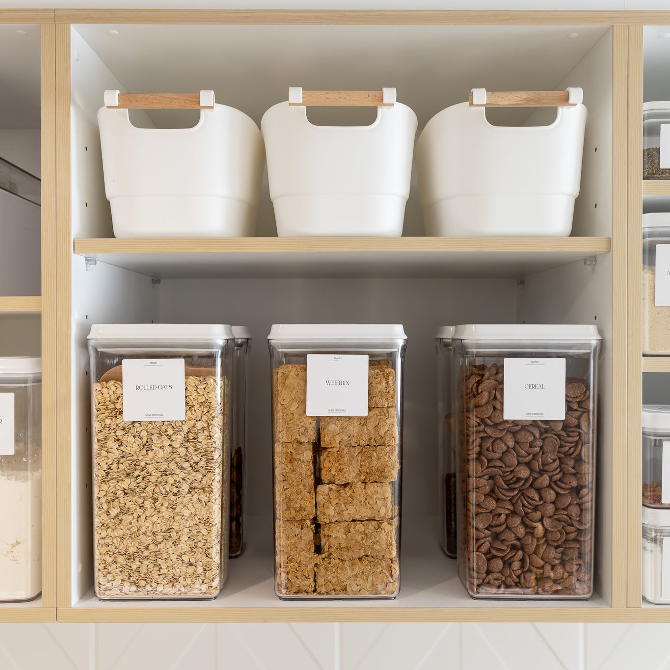 Storage shelves with labeled containers in a kitchen setting