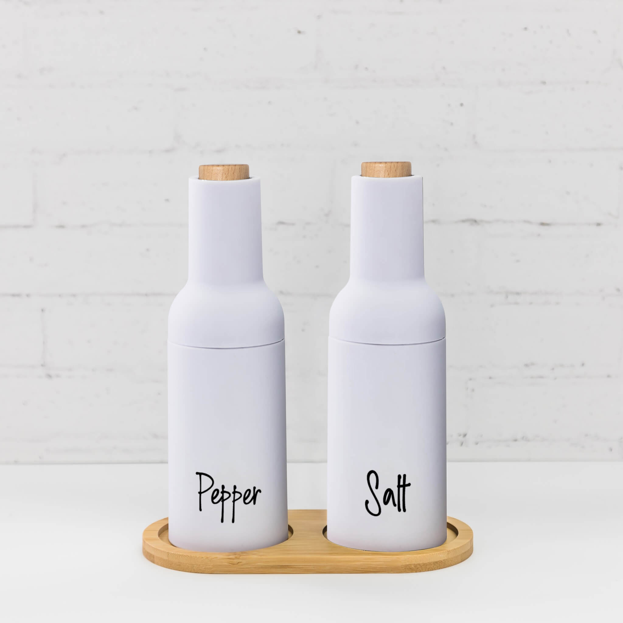 Stylish White Salt & Pepper Mills – Modern gravity grinders with a clean, white finish for a chic kitchen look
