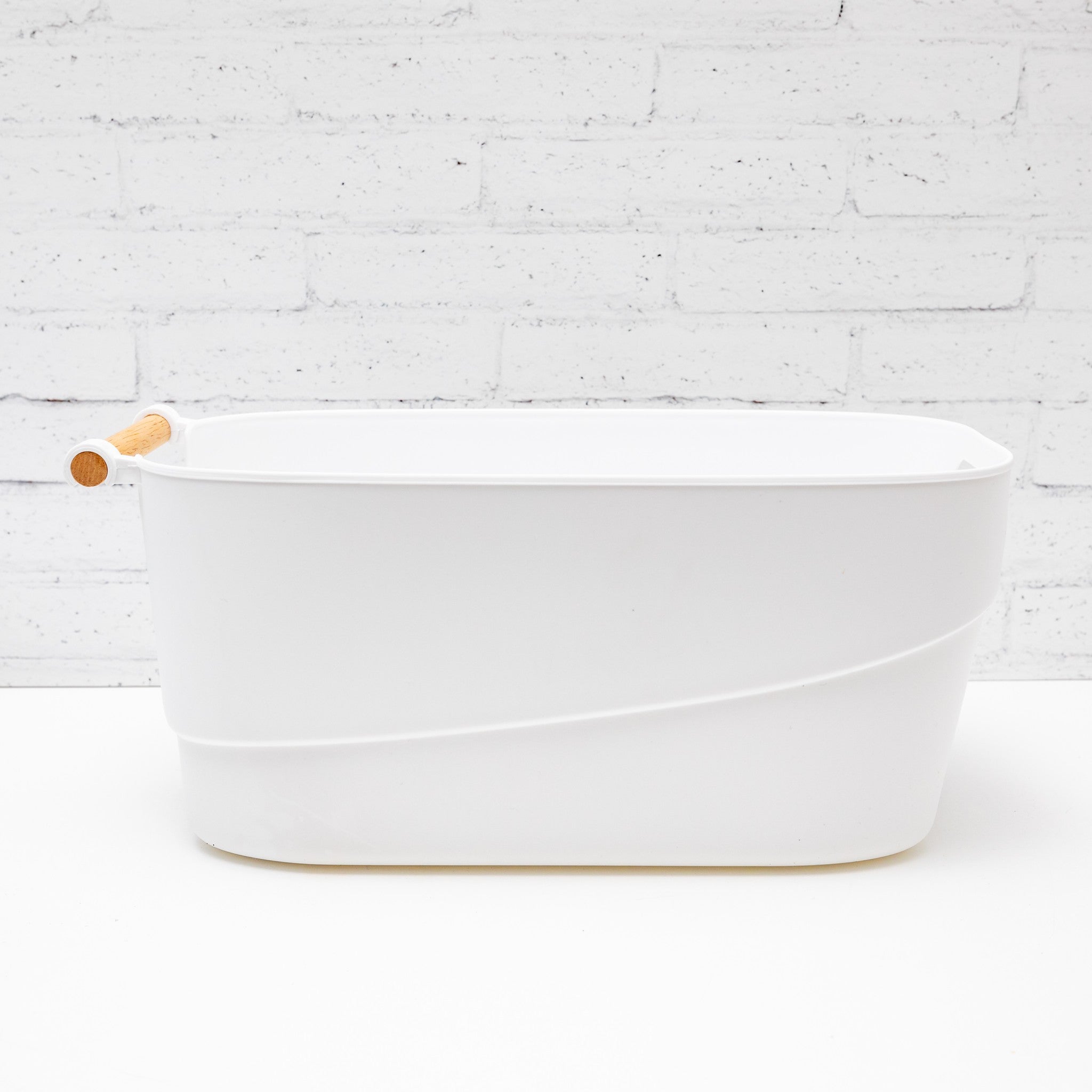 Organised pantry storage tub with labels for easy identification of contents.