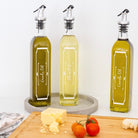 Plastic oil pourer being used for precise dispensing of oil.