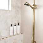 Organised bathroom with Luxe label collection on pump bottles