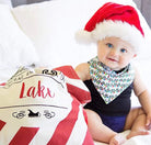 Customisable candy stripe Santa sack designed for festive gifting.