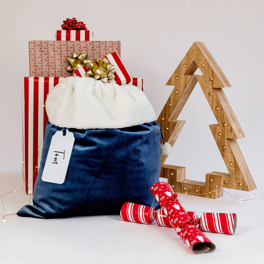 Customisable velvet Santa sack with an acrylic tag for a personalised touch.