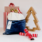 Customisable velvet Santa sack with an acrylic tag for a personalised touch.