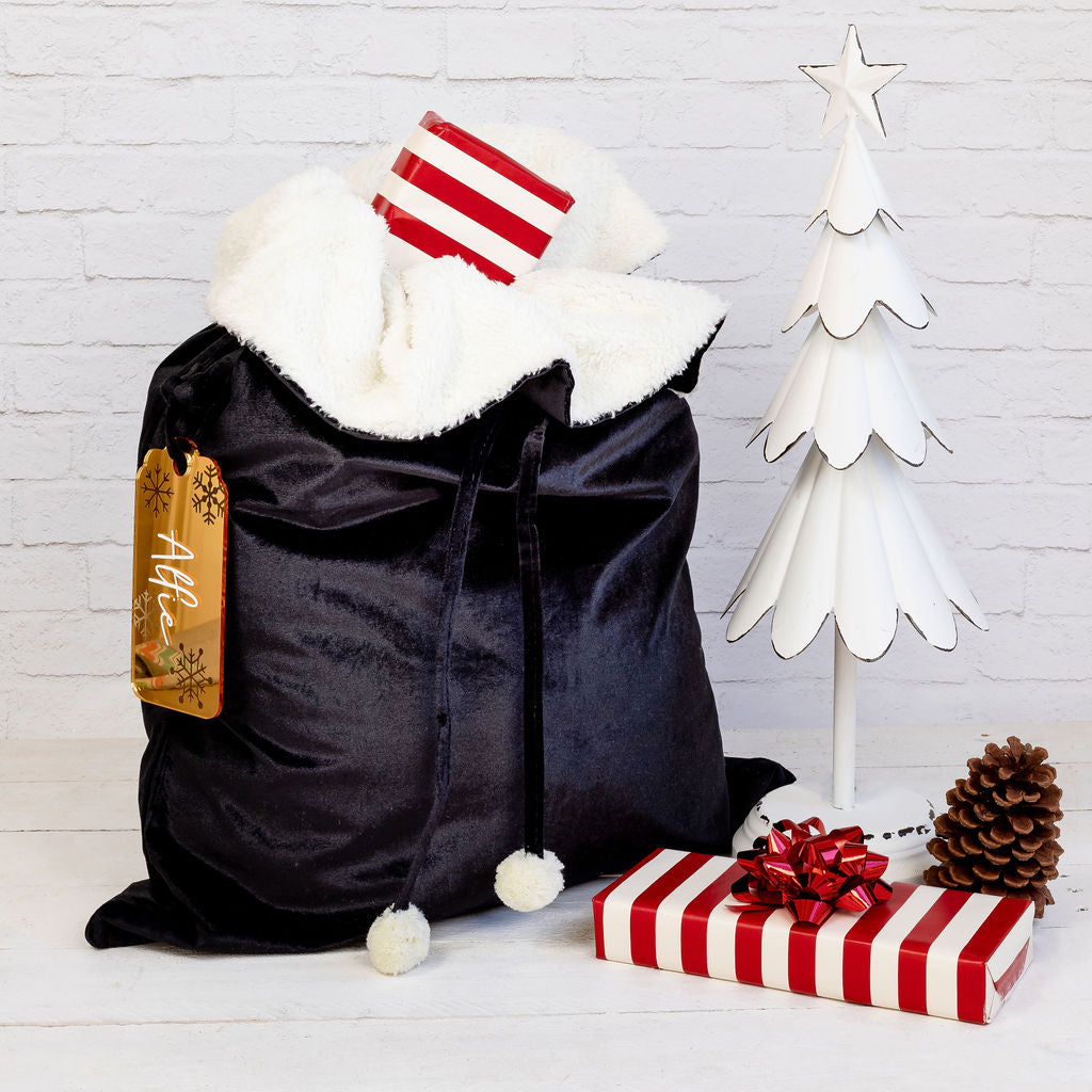 Display of personalised velvet Santa sacks, ideal for creating memorable Christmas traditions.