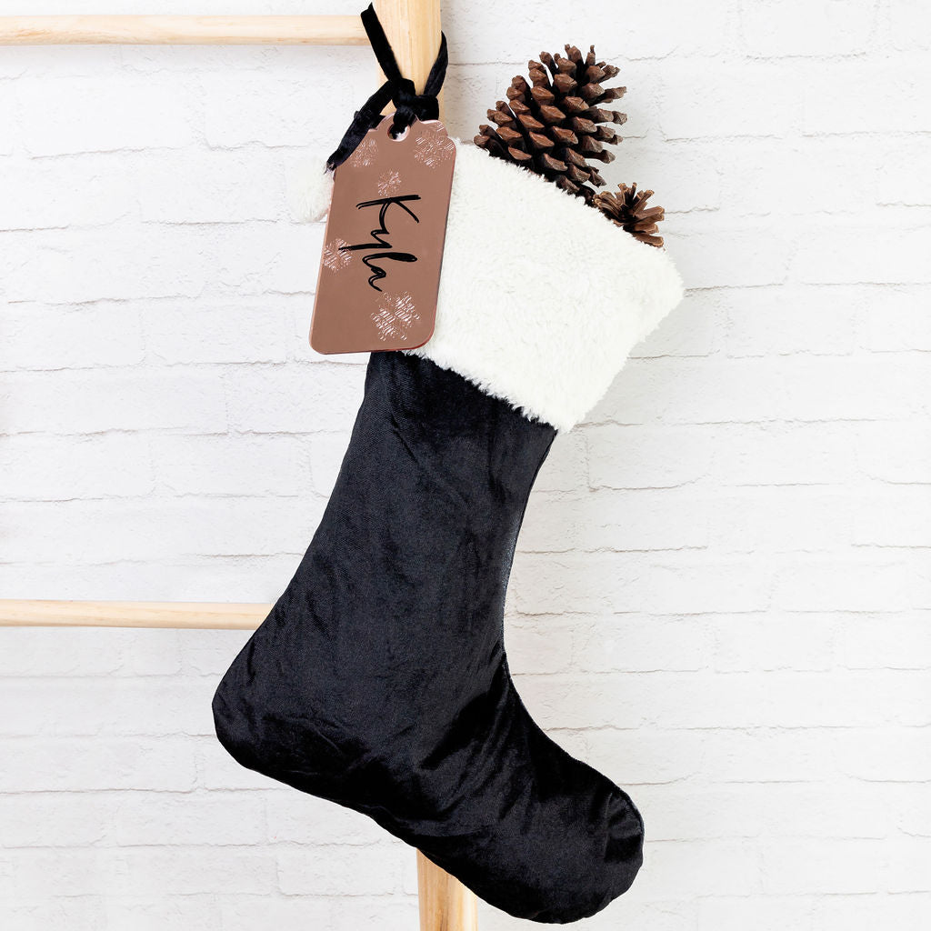 Matching velvet Santa stockings for siblings or family members.