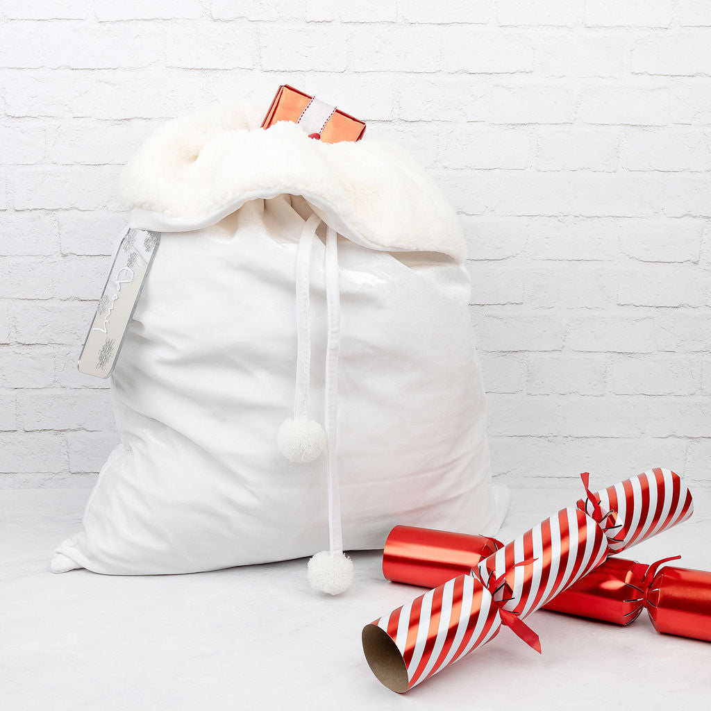 Collection of various personalised velvet Santa sacks for the festive season.