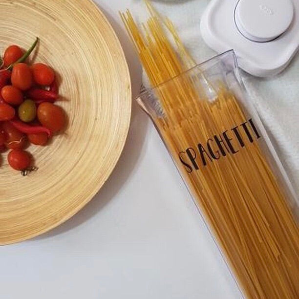 Pantry organisation with pre-made labels for easy access to pantry essentials.