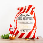 Personalised candy stripe Christmas Santa sack, perfect for Christmas gift storage.