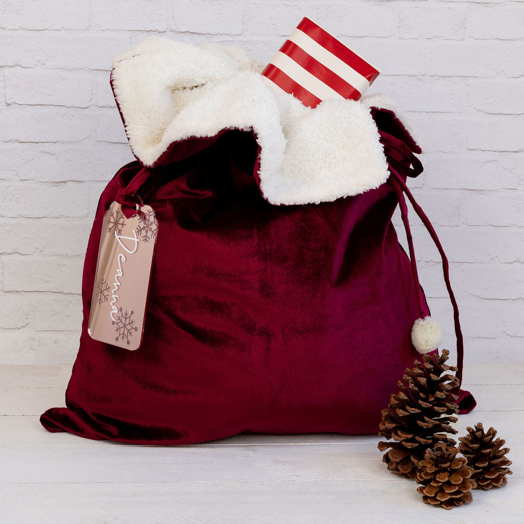 Personalised velvet Santa sack measuring 70cm x 50cm, perfect for Christmas gifts.