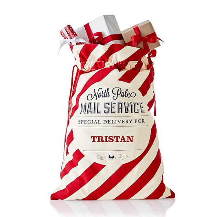 Reusable personalised candy stripe Santa sack for Christmas celebrations.