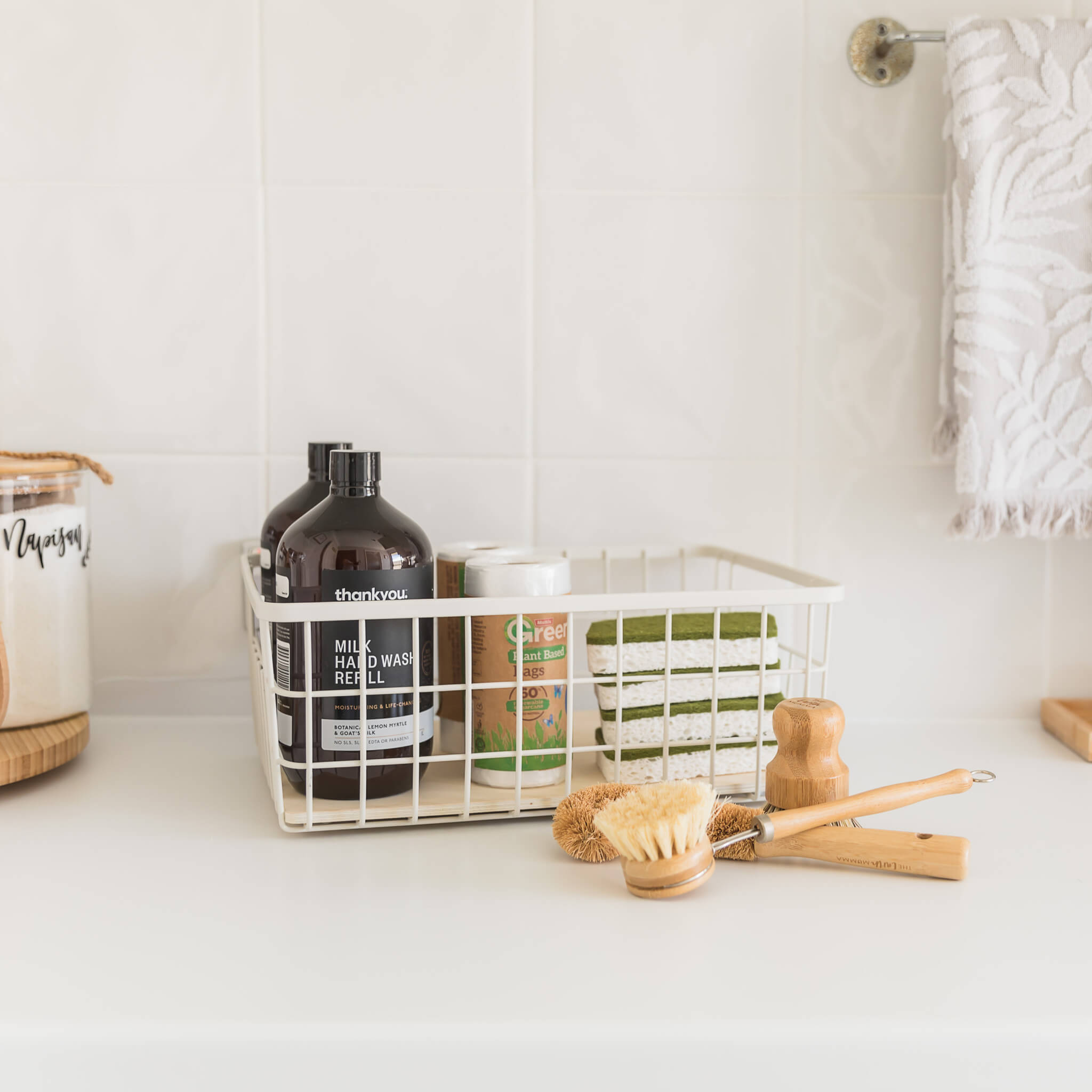 Stylish storage solution featuring a metal basket with a wooden base.