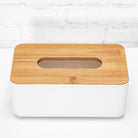 Tissue box with bamboo lid placed stylishly in a bathroom setting.