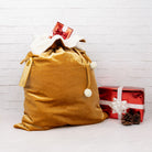 Velvet Santa sack filled with gifts, ready for Christmas morning.